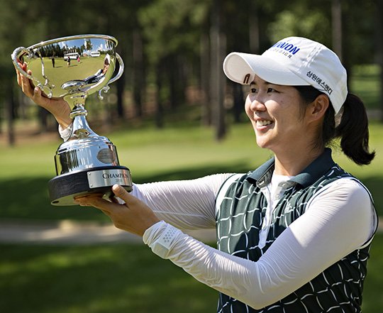 Submitted photo SHOOTOUT WINNER: Hyemin Kim, of Seoul, South Korea, presents her trophy Sunday won at the 2018 Murphy USA El Dorado Shootout at the Mystic Creek Golf Course in El Dorado. Photo courtesy of the Symetra Tour.