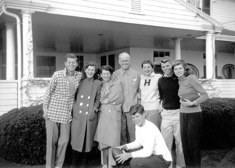 In this circa 1948 photo provided by the Kennedy Family Collection, courtesy of the John F. Kennedy Library Foundation, members of the Kennedy family pose for a photo in Hyannis Port, Mass. They are from left, John F. Kennedy, Jean Kennedy, Rose Kennedy, Joseph P. Kennedy Sr., Patricia Kennedy, Robert F. Kennedy, Eunice Kennedy, and in foreground, Edward M. Kennedy. The Boston-based museum completed an 18-month project in 2018 to catalog and digitize more than 1,700 black-and-white Kennedy family snapshots that are viewable online, giving a nation still obsessed with &quot;Camelot&quot; a candid new glimpse into their everyday lives. (Kennedy Family Collection/John F. Kennedy Library Foundation via AP)