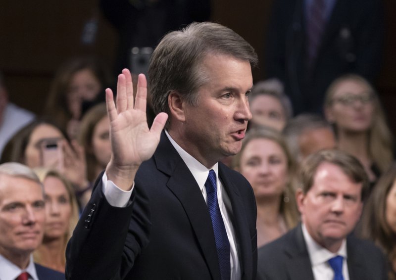 The Associated Press SWORN IN: In this Sept. 4 file photo, President Donald Trump's Supreme Court nominee Brett Kavanaugh is sworn in before the Senate Judiciary Committee on Capitol Hill in Washington. Both parties are grappling with tremendous political risks in the midst of an increasingly messy Supreme Court fight. Republicans risked alienating women, particularly in the nation's suburbs, by embracing President Trump's hand-picked nominee even after allegations surfaced of decades-old sexual misconduct. Democrats, who want to delay the high-stakes nomination, risked energizing complacent Republican voters should they play politics with the sensitive allegations.