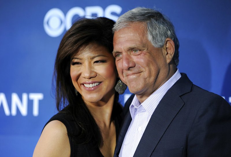 In this June 16, 2014, file photo, Les Moonves, right, then-president and CEO of CBS Corp., and his wife, Julie Chen, pose together at the premiere of the CBS science fiction television series "Extant" in Los Angeles. 