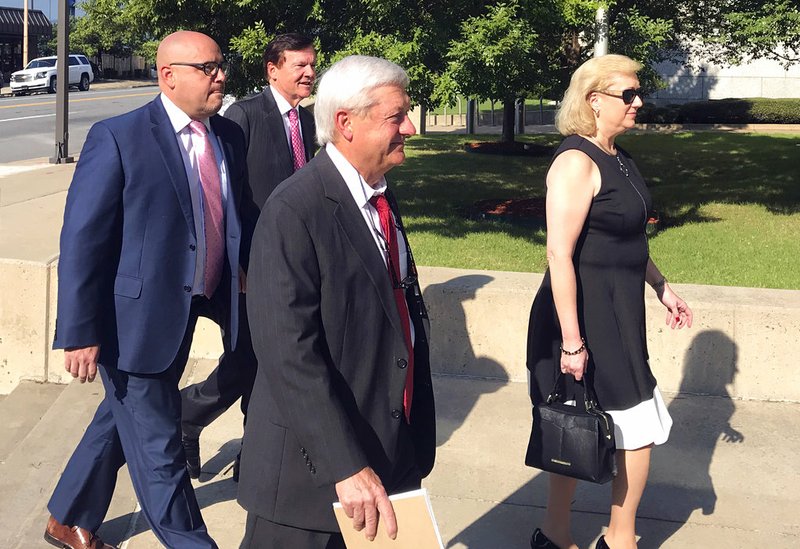 Former state Sen. Jeremy Hutchinson, left, arrives at the federal courthouse in Little Rock on Tuesday, Sept. 18, 2018, for his first court appearance on federal corruption charges. 