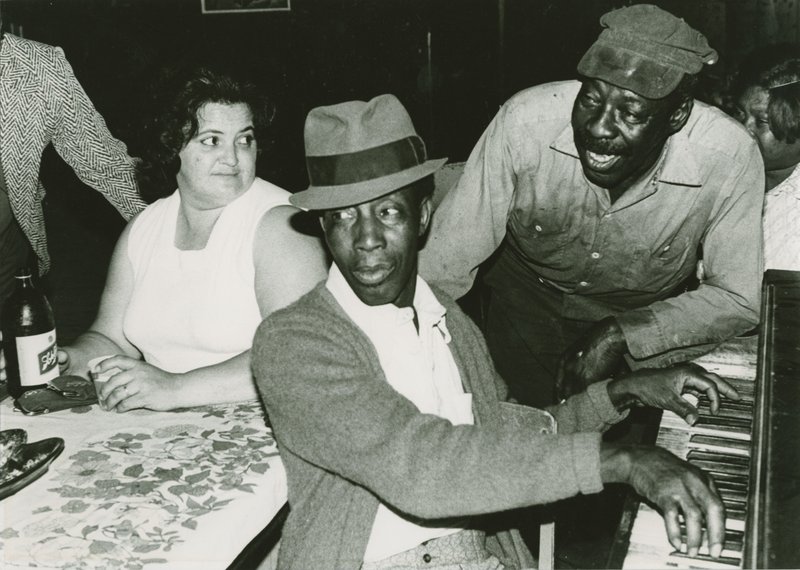 Marshall Darrough (piano) and Friends, Jungle Hutt Club, Pine Bluff, 1976, a silver gelatin print by Cheryl Cohen, is part of “The Ar- kansas Blues: Photographs by Cheryl Cohen and Louis Guida,” on display at the Galleries at Library Square (formerly the Butler Center Galleries). 