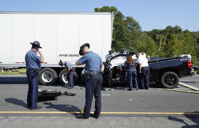 Arkansas Democrat-Gazette/STATON BREIDENTHAL --9/18/18-- Emergency personnel including Arkansas State Police investigate a fatality accident Tuesday in the westbound lanes of Interstate 30 near the Geyer springs Road exit. Traffic was slow on the highway from an earlier wreck.