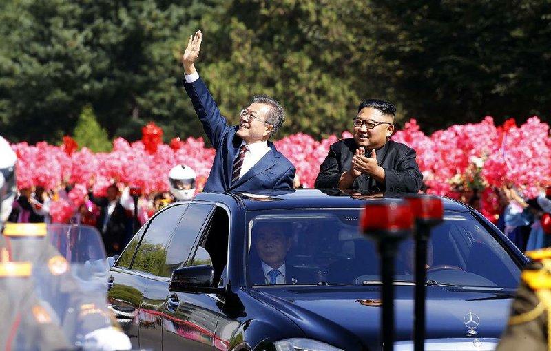 South Korean President Moon Jae-in (left) and North Korean leader Kim Jong Un parade through Pyongyang, North Korea, after Moon’s arrival there Tuesday for talks on the North’s nuclear program. Moon later announced that Kim had agreed to dismantle a missile test site and would agree to further measures if the U.S. would take similar steps. 