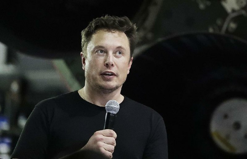 In this Monday, Sept. 17, 2018, file photo Tesla CEO and SpaceX founder and chief executive Elon Musk speaks after announcing Japanese billionaire Yusaku Maezawa as the first private passenger on a trip around the moon in Hawthorne, Calif. 