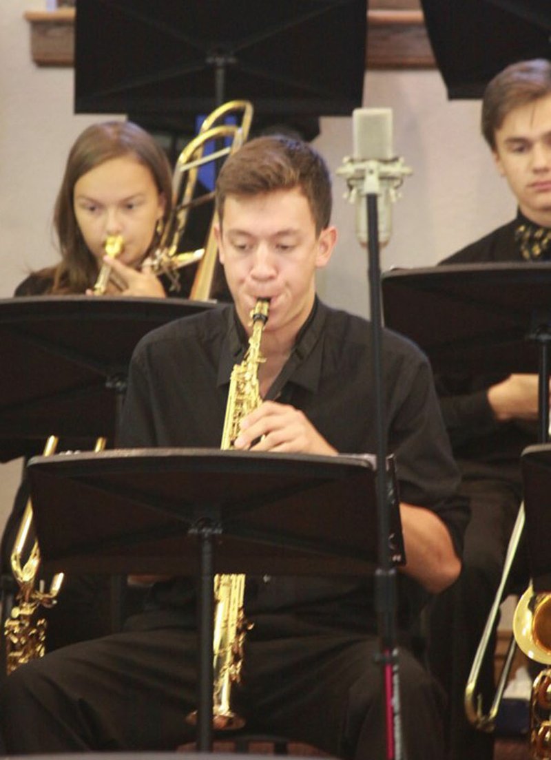 Photo by Dan Fogleman, BHS Jazz Band Brad Chu, soprano sax player, of the Bentonville High School Jazz Band, plays his instrument.