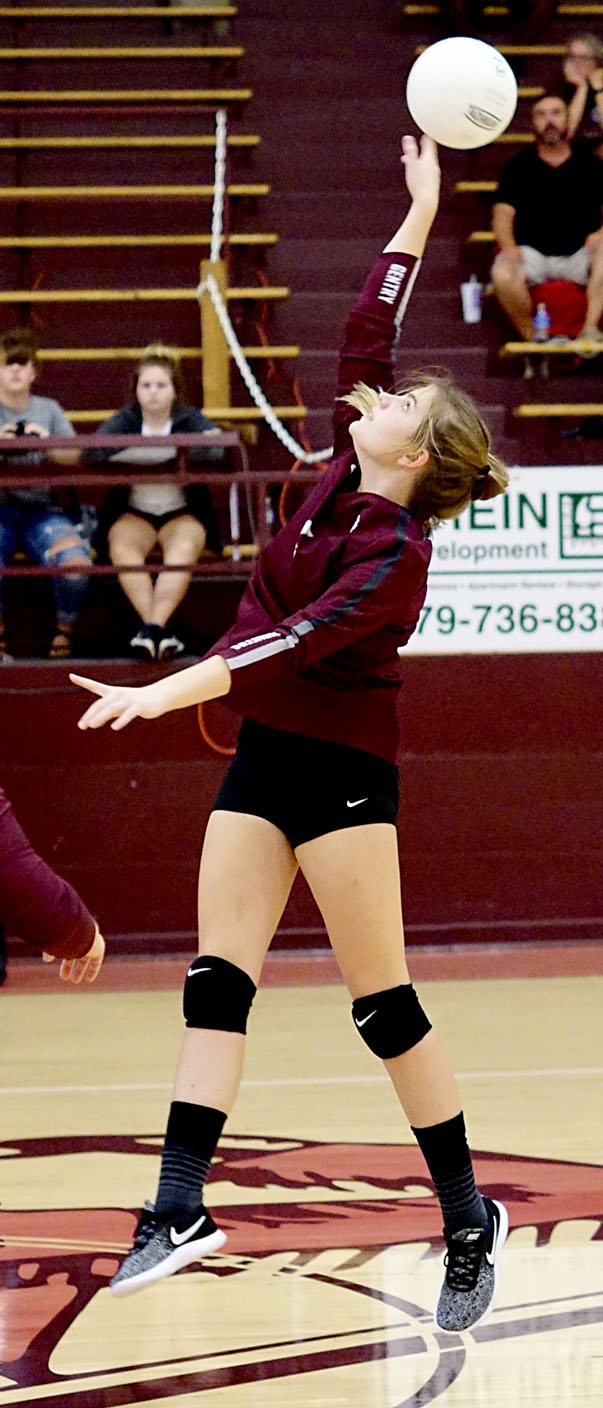 Westside Eagle Observer/RANDY MOLL Katelyn Adams, a Gentry senior, hits the ball back across the net in a kill attempt on Thursday (Sept. 13, 2018) in Gentry during play against Prairie Grove.