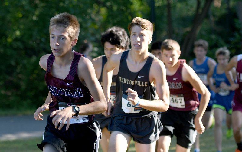 Bud Sullins/Special to the Herald-Leader Michael Capehart of Siloam Springs, left, leads a group of runners Saturday morning during the 2018 Panther Cross Country Classic.