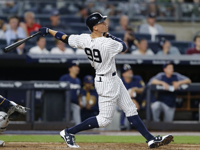 In this July 7, 2017, file photo, New York Yankees Aaron Judge watches his fifth-inning solo home run in the team's baseball game against the Milwaukee Brewers, in New York. (AP Photo/Kathy Willens, File)