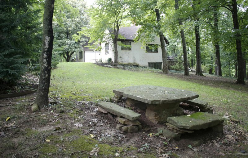 File photo/NWA Democrat-Gazette/DAVID GOTTSCHALK The cottage near Pratt Place Inn and Barn is seen Aug. 8 at Markham Hill in Fayetteville. Specialized Real Estate has plans to develop a portion of the hill.