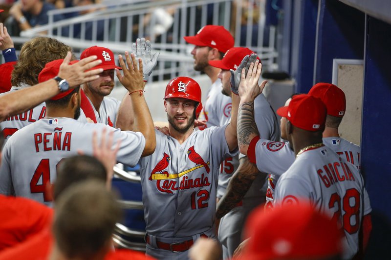 St. Louis Cardinals' Paul DeJong (12) is congratulated by teammates after his two-run home run during the fourth inning of a baseball game against the Atlanta Braves, Tuesday, Sept. 18, 2018, in Atlanta. (AP Photo/Todd Kirkland)