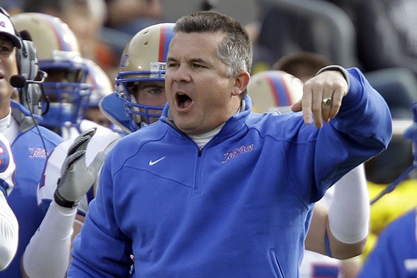 Tulsa coach Todd Graham gestures on the sideline as his team plays Notre Dame during the first half of an NCAA college football game, Saturday, Oct. 30, 2010, in South Bend, Ind., when Tulsa defeated Notre Dame 28-27. Graham hired Gus Malzahn and Chad Morris at Tulsa. (AP Photo/Michael Conroy)

