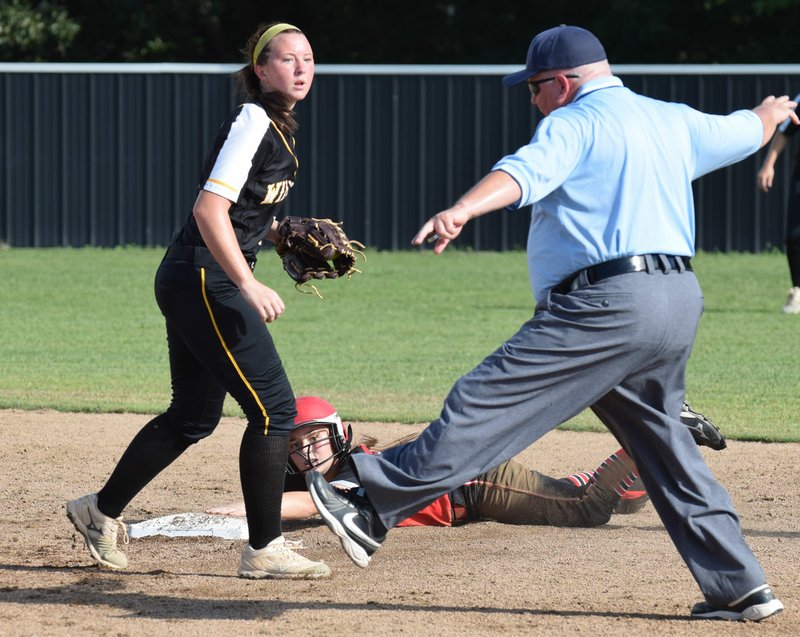 RICK PECK/SPECIAL TO MCDONALD COUNTY PRESS McDonald County's Kristen Cornell looks back at the umpire before being called out while attempting to steal second base in the Lady Mustangs' 8-0 win over Cassville on Sept. 13 at MCHS.