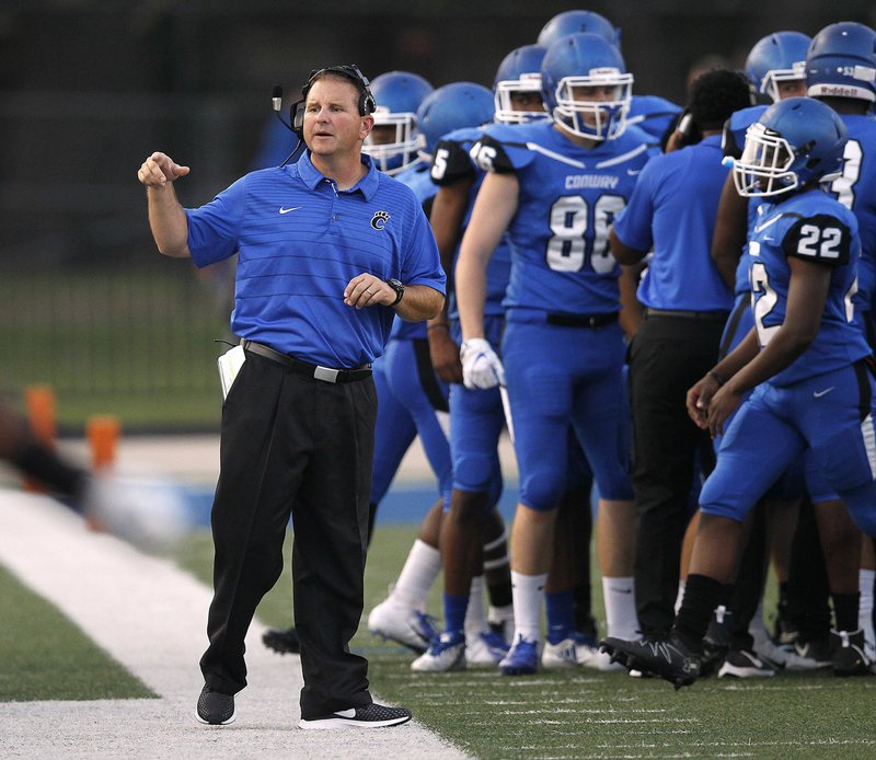 Arkansas Democrat-Gazette/THOMAS METTHE -- 8/25/2018 -- Conway coach Keith Fimple paces the sidelines during the Wampus Cats' game against El Dorado on Friday, Aug. 25, 2018 at Centennial Bank Field in Conway. Fimble, a longtime assistant at Fort Smith Southside and college roomate of Southside coach Jeff Williams, will take his team to Fort Smith on Friday to open 7A-Central action.