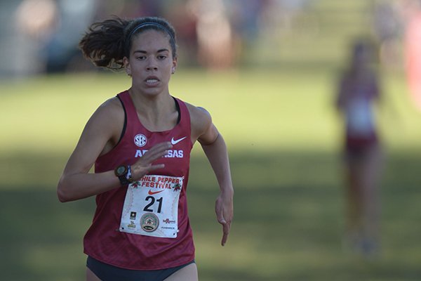 Arkansas freshman Aston Endsley nears the finish line to take fourth place in the women's collegiate race Saturday, Sept. 30, 2017, during the 29th annual Chile Pepper Cross Country Festival at Ari Park in Fayetteville.