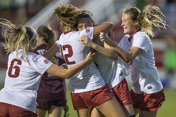 Carly Hoke (from left), Kayla McKeon, Tori Cannata and Stefani Doyle of Arkansas celebrate after a goal by Cannata in the second half of a match against Texas A&M on Thursday, Sept. 20, 2018, at Razorback Field in Fayetteville.
