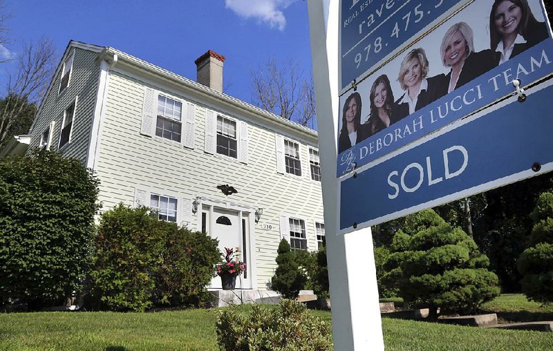 Sales of existing homes like this one in North Andover, Mass., were static in August as middle-class buyers increasingly are priced out of the market. 