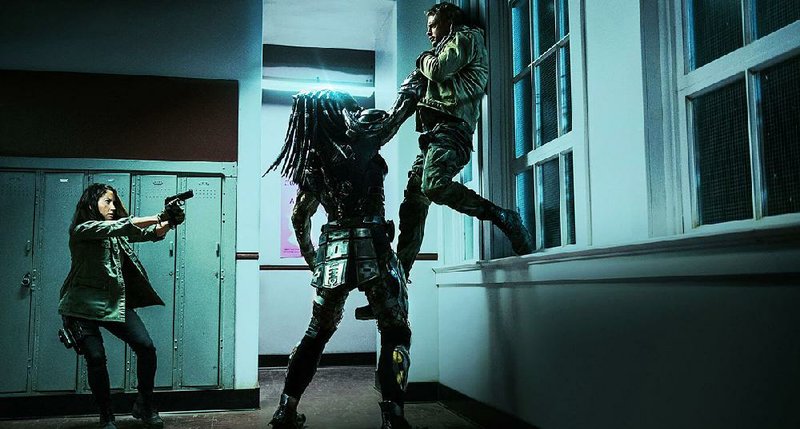 Olivia Munn (left) is among the stars of 20th Century Fox’s The Predator. It came in first at last weekend’s box office and made about $24.6 million.