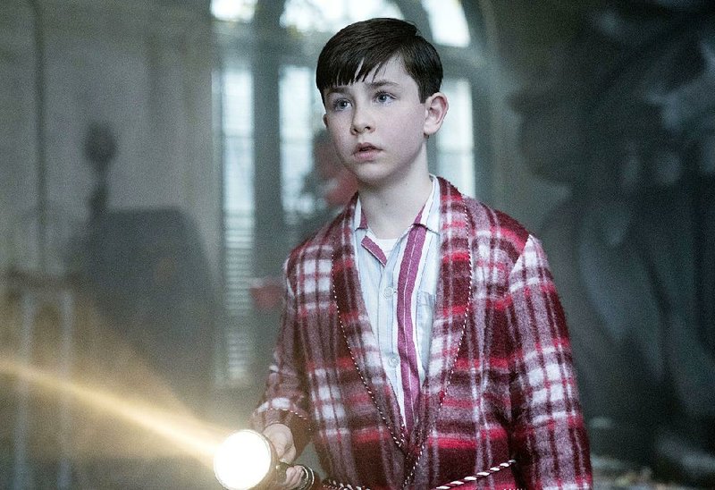 Orphaned Lewis Barnavelt (Owen Vaccaro) is sent to live with his eccentric and sometimes magically potent uncle in Eli Roth’s The House With the Clock in Its Walls.