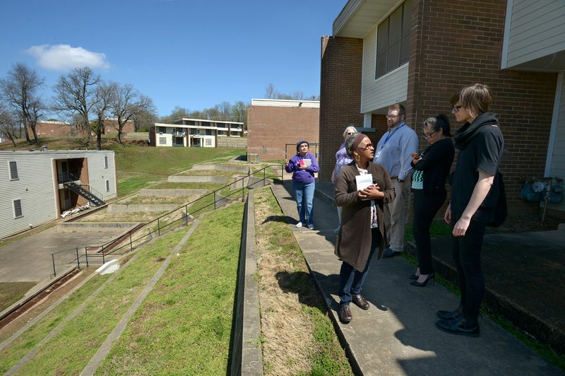 File photo/NWA Democrat-Gazette/ANDY SHUPE Deniece Smiley (center), former Fayetteville Housing Authority director, participates in a tour March 30 at Willow Heights, 10 S. Willow Ave. in Fayetteville.