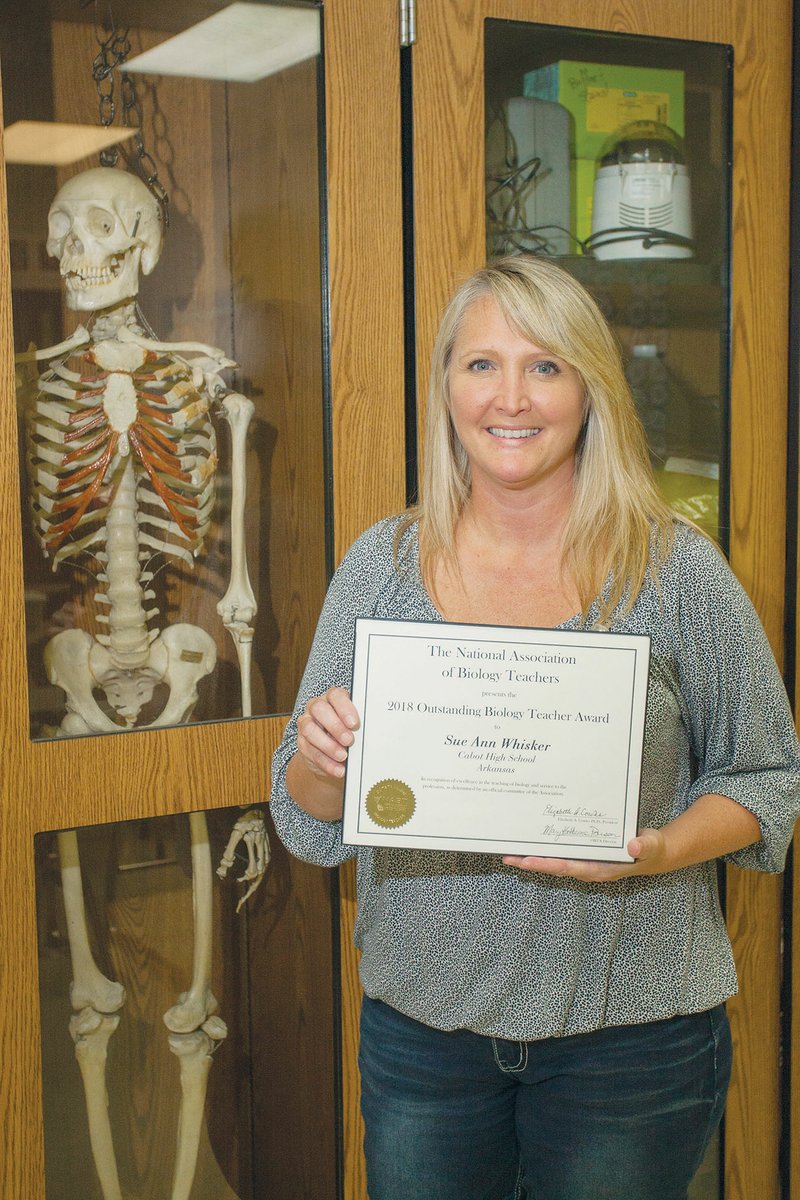 SueAnn Whisker of Cabot holds her certificate recognizing her as the 2018 Outstanding Biology Teacher for Arkansas from the National Association of Biology Teachers. Whisker is in her 20th year in education, having started her career in Crowley, Texas.