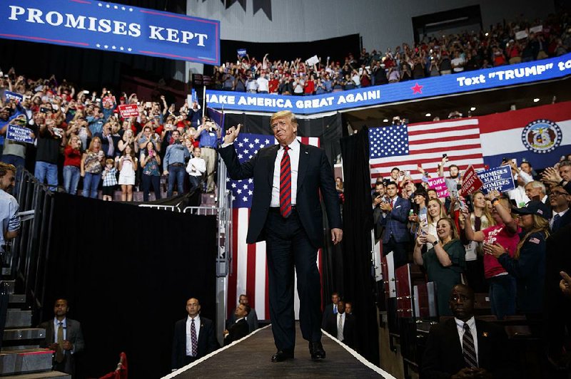 President Donald Trump greets the crowd as he arrives for a rally Friday in Springfield, Mo., in support of Josh Hawley, who is trying to unseat Democratic U.S. Sen. Claire McCaskill.