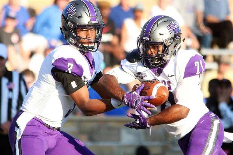 Quarterback Breylin Smith (left) and the University of Central Arkansas offense are averaging 371.3 yards per game this season behind an offensive line that returned only one starter from a year ago. 