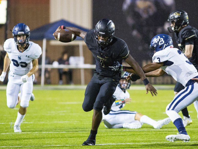 SPRINGDALE Har-Ber VS BENTONVILLE - Preston Crawford of Bentonville runs the ball as Justin Moto attempts to bring him down at Tigers Stadium, Bentonville, AR, on Friday September 21, 2018. Special to NWA Democrat-Gazette/ David Beach