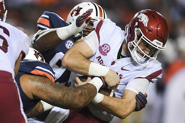 Arkansas quarterback Ty Storey falls forward during a game against Auburn on Saturday, Sept. 22, 2018, in Auburn, Ala. 