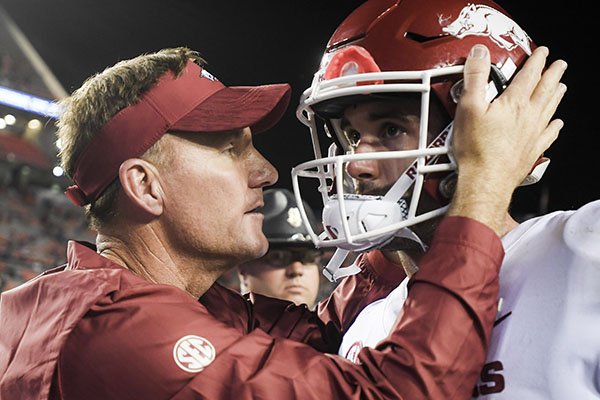 Arkansas coach Chad Morris (left) talks with quarterback Ty Storey following a game against Auburn on Saturday, Sept. 22, 2018, in Auburn, Ala. The Razorbacks lost to the Tigers, 34-3.