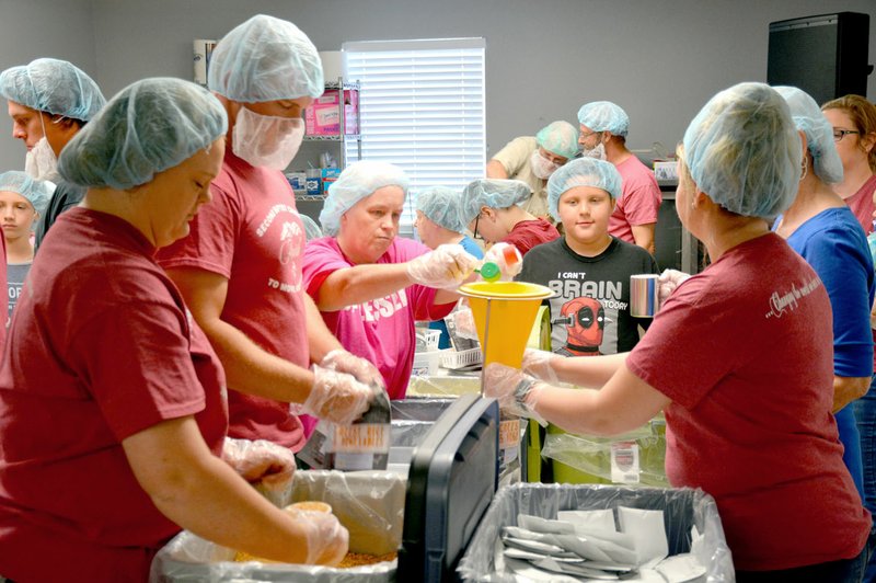 Janelle Jessen/Herald-Leader Members of Second Baptist Church packed more than 5,000 meals, or about 650 meal packs, at a packing party facilitated by The Pack Shack on Sept. 15. Each package provides a complete meal for eight people.