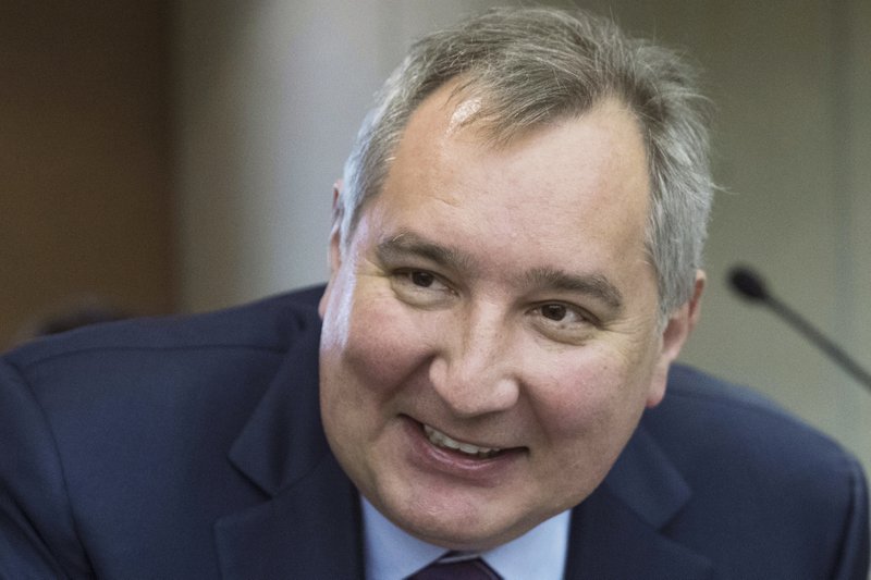 FILE In this file photo taken on Wednesday, April 11, 2018, Russian Deputy Prime Minister Dmitry Rogozin smiles before Russian Prime Minister Dmitry Medvedev's annual report on country's economic and social development in the State Duma, the Lower House of the Russian Parliament, in Moscow, Russia. Rogozin said Saturday, Sept. 22, 2018 that Russia wouldn't accept a second-tier role in a NASA-led plan to build an outpost near the moon, but his spokesman quickly clarified that Russia is staying in the project. (AP Photo/Pavel Golovkin, File)