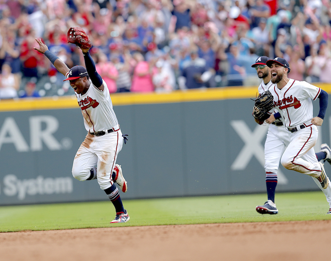 Ozzie Albies gets drenched in champagne