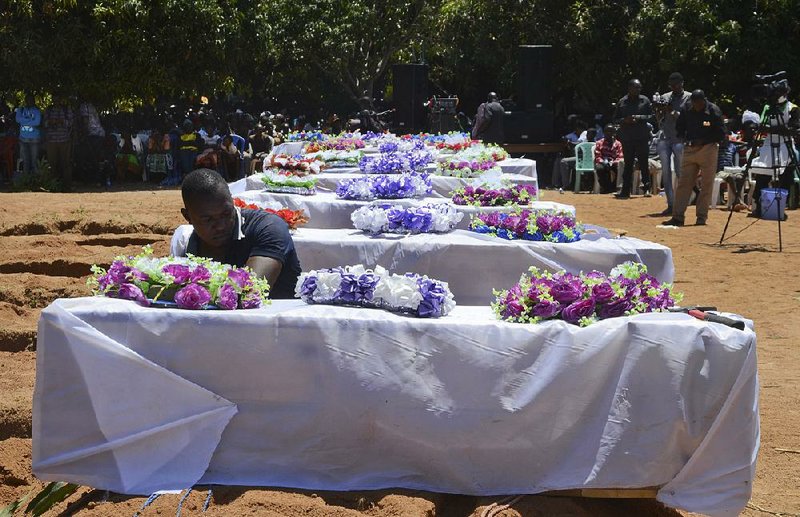 Coffins for some of the victims of a passenger-ferry accident are lined up Sunday at a mass-burial ceremony on Ukara Island, Tanzania. More than 200 people died after the ferry capsized on Lake Victoria last week. 