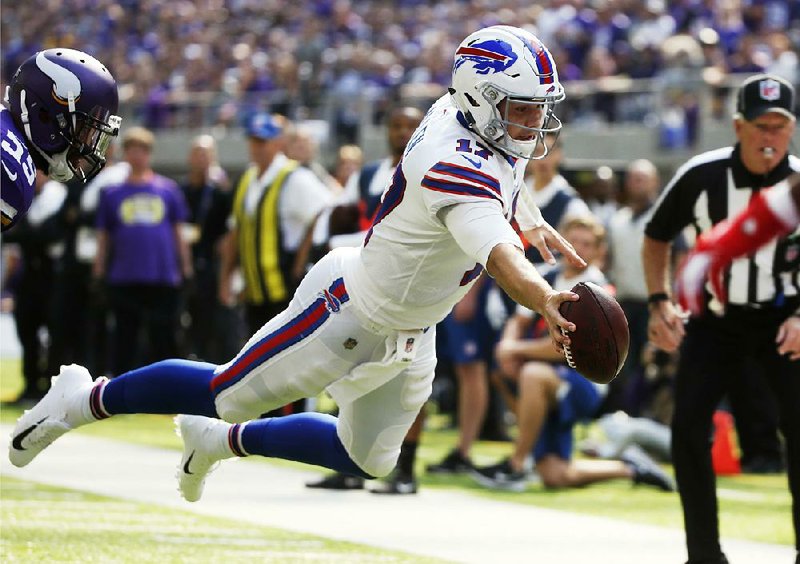 Buffalo quarterback Josh Allen ran for two touchdowns and threw for another in the Bills’ 27-6 victory over the Minnesota Vikings on Sunday.