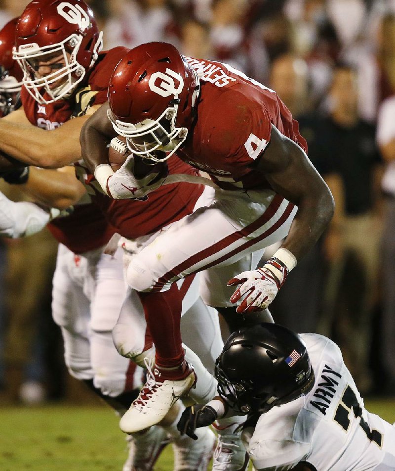 Oklahoma running back Trey Sermon (4) ran for 119 yards on 18 carries in the Sooners’ 28-21 overtime victory over Army on Saturday night.