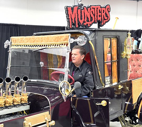 The Sentinel-Record/Grace Brown MUNSTER COACH: Butch Patrick, who portrayed Eddie Munster on the 1960s sitcom "The Munsters," revs up the Munster Coach Sunday during the third annual Spa-Con at the Hot Springs Convention Center.