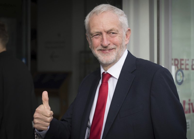 Britain's main opposition Labour Party leader Jeremy Corbyn gives a thumbs up gesture as he arrives for an interview by BBC TV journalist Andrew Marr, in Liverpool, England, Sunday Sept. 23, 2018. The Labour Party is holding its annual party conference in Liverpool, which is due to decide on decisive issues like whether to back a new Brexit referendum on the country's departure from the European Union. (Stefan Rousseau/PA via AP)