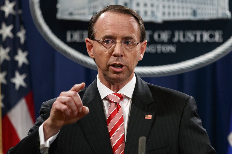 FILE - In this July 13, 2018, file photo, Deputy Attorney General Rod Rosenstein speaks during a news conference at the Department of Justice in Washington. Rosenstein is denying a report in The New York Times that he suggested last year that he secretly record President Donald Trump in the White House to expose the chaos in the administration. Rosenstein says the story is &#x201c;inaccurate and factually incorrect.&#x201d; (AP Photo/Evan Vucci, File)