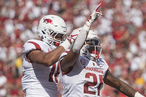 Jeremy Patton, Arkansas tight end, congratulates Devwah Whaley (21), Arkansas running back, after Whaley scored a touchdown in the second quarter vs Eastern Illinois Saturday, Sept. 1, 2018, at Razorback Stadium in Fayetteville.