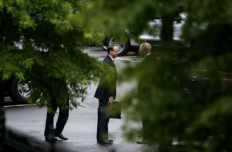Deputy Attorney General Rod Rosenstein (left) meets with White House Chief of Staff John Kelly on Monday outside the West Wing of the White House in Washington.
