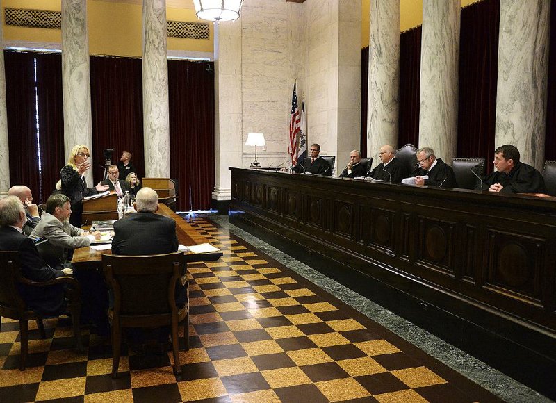 Attorney Teresa Toriseva (left) presents arguments before the West Virginia Supreme Court of Appeals on Monday at the West Virginia Capitol in Charleston, W.Va.