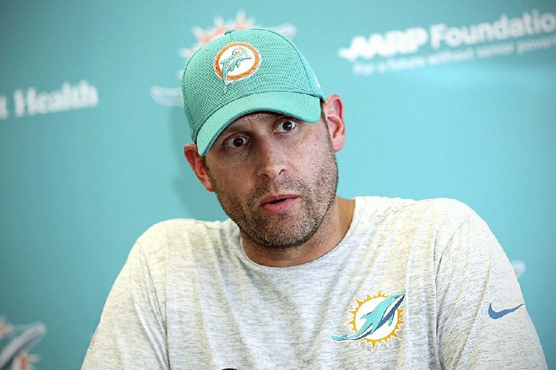 Miami Dolphins head coach Adam Gase speaks to the media after  NFL football practice in Davie, Fla., Friday, Sept. 14, 2018.