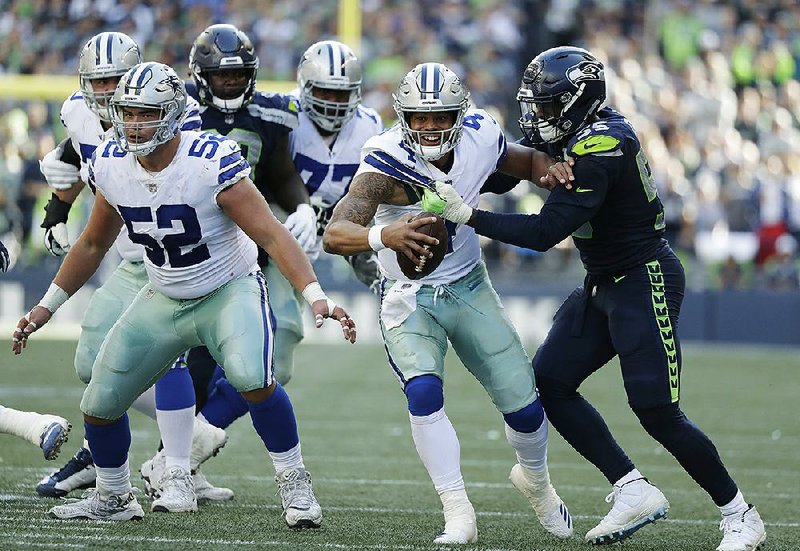 Dallas Cowboys quarterback Dak Prescott (4) has not thrown for more than 200 yards in five consecutive games. The Cowboys, who lost to Seattle 24-13 on Sunday, are off to a 1-2 start.