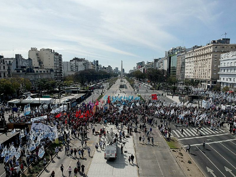 Demonstrators march against the government of President Mauricio Macri and his economic policies, in Buenos Aires, Argentina on Monday. Argentina’s powerful National Confederation of Workers union is calling for a national strike today to protest against the International Monetary Fund economic measures that Macri has implemented.