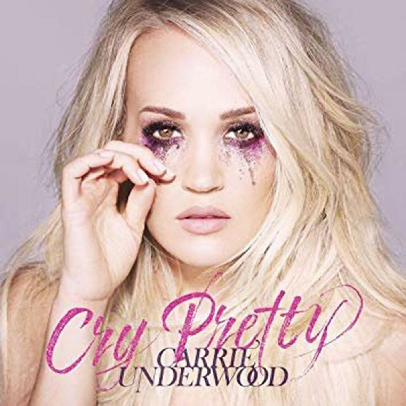 Carrie Underwood says the songs on her latest album are about hope for a better world. 