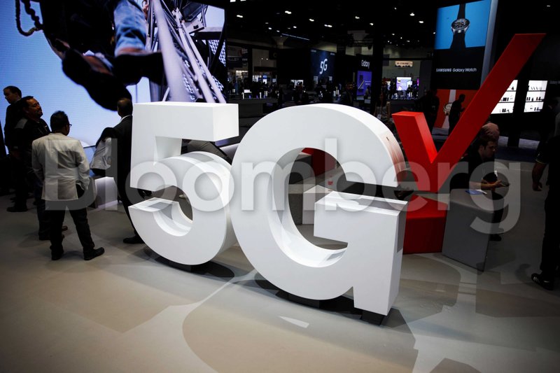 Verizon Communications Inc. 5G wireless signage is displayed at the company's booth during the Mobile World Congress Americas in Los Angeles on Sept. 12, 2018. ThMUST CREDIT: Bloomberg photo by Patrick T. Fallon