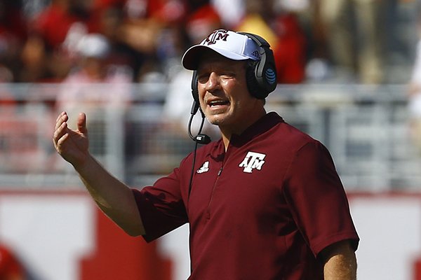 Texas A&M head coach Jimbo Fisher signals to players during the first half of an NCAA college football game against Alabama, Saturday, Sept. 22, 2018, in Tuscaloosa, Ala. (AP Photo/Butch Dill)

