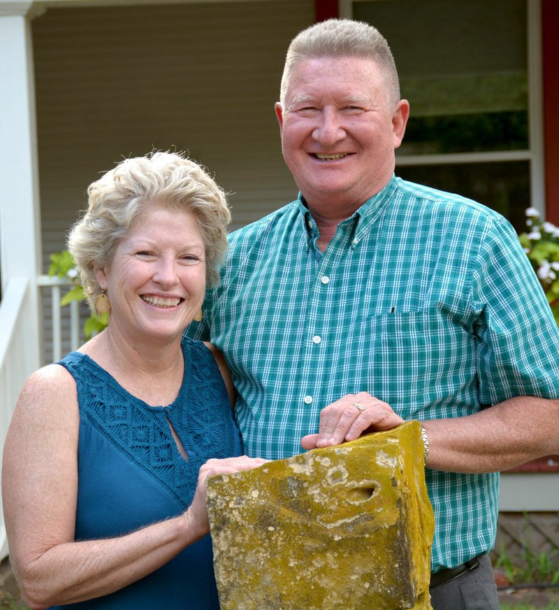 Janelle Jessen/Herald-Leader Brenda and Tim McCord stood in front of their home with their hands on a post rock mailbox, brought back from western Kansas. The couple will be honored at the Chamber of Commerce Outstanding Civic Leadership Event on Thursday.