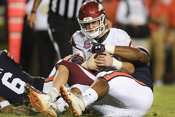 Arkansas quarterback Ty Storey is sacked during a game against Auburn on Saturday, Sept. 22, 2018, in Auburn, Ala.